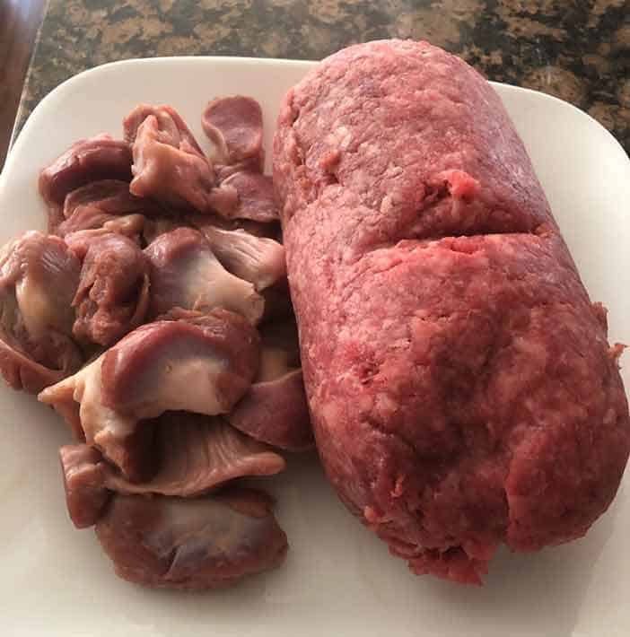 Mince beef and chicken gizzard Chicken gizzard and mince beef on the white plate